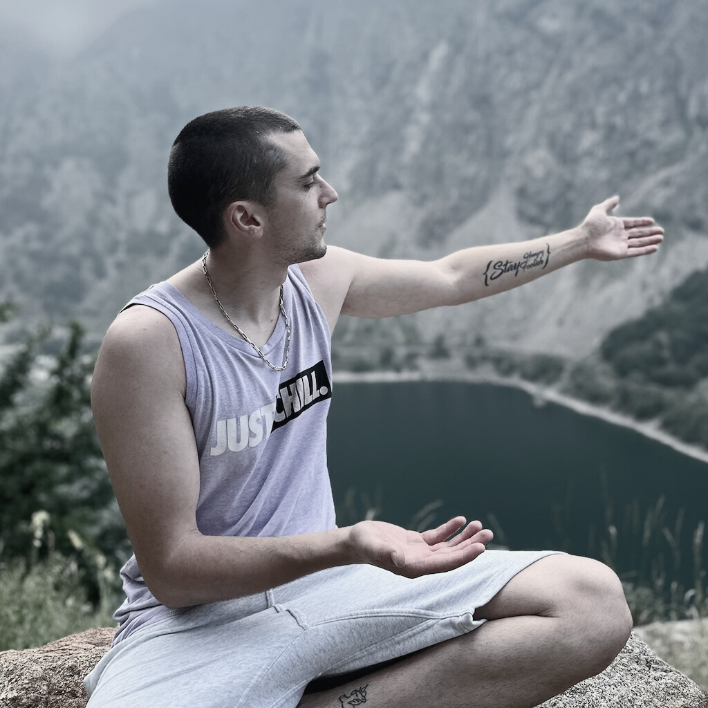 Portrait of Cosmin Irimescu, software engineer, with visible tattoo that reads 'Stay hungry, stay foolish'.